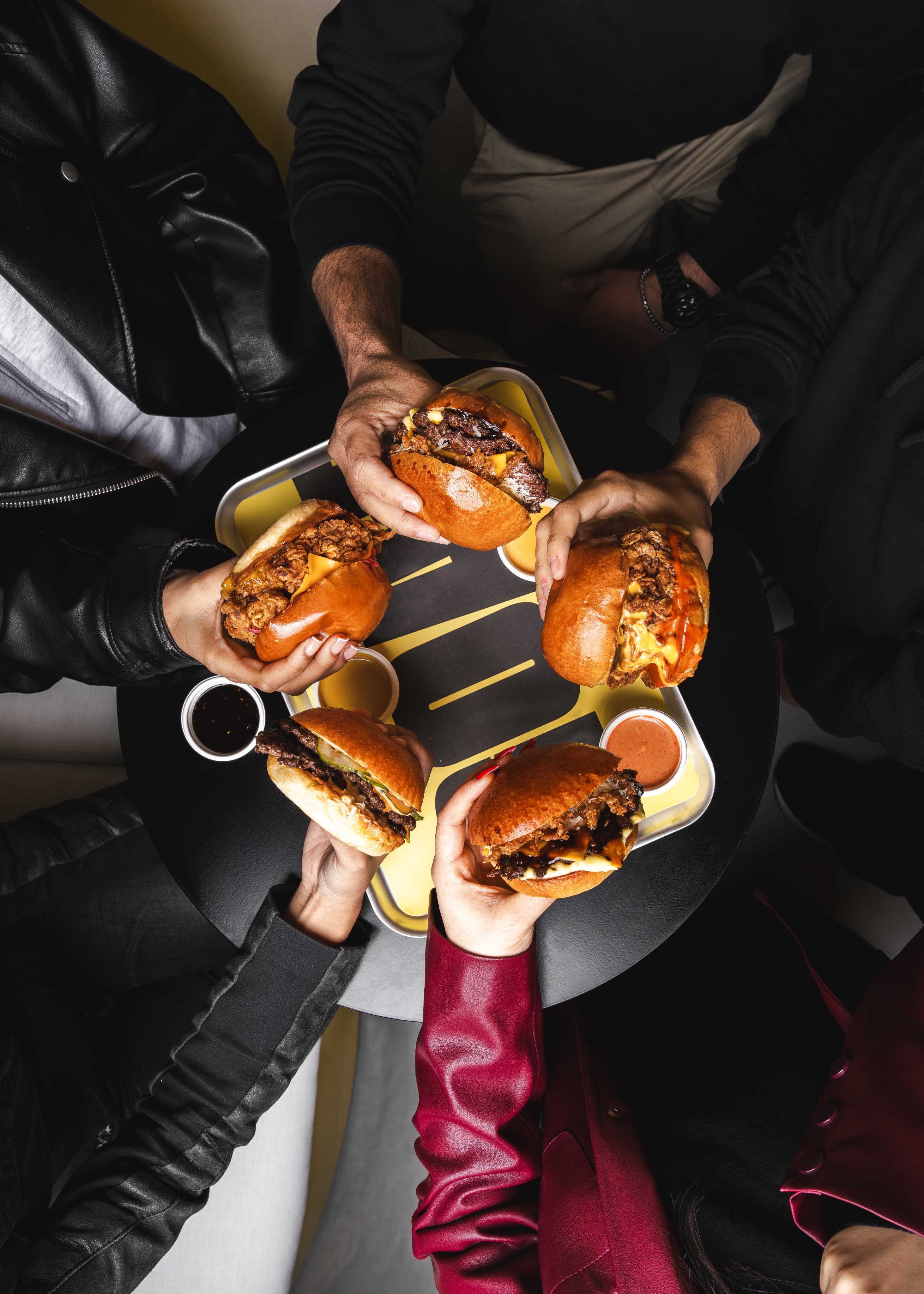 Friends sharing burgers