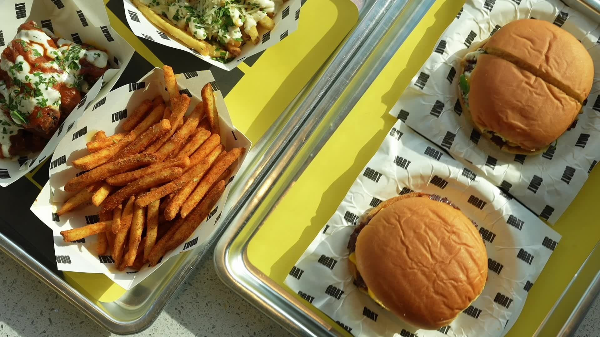 G.O.A.T. Burger tray with fries and dipping sauces